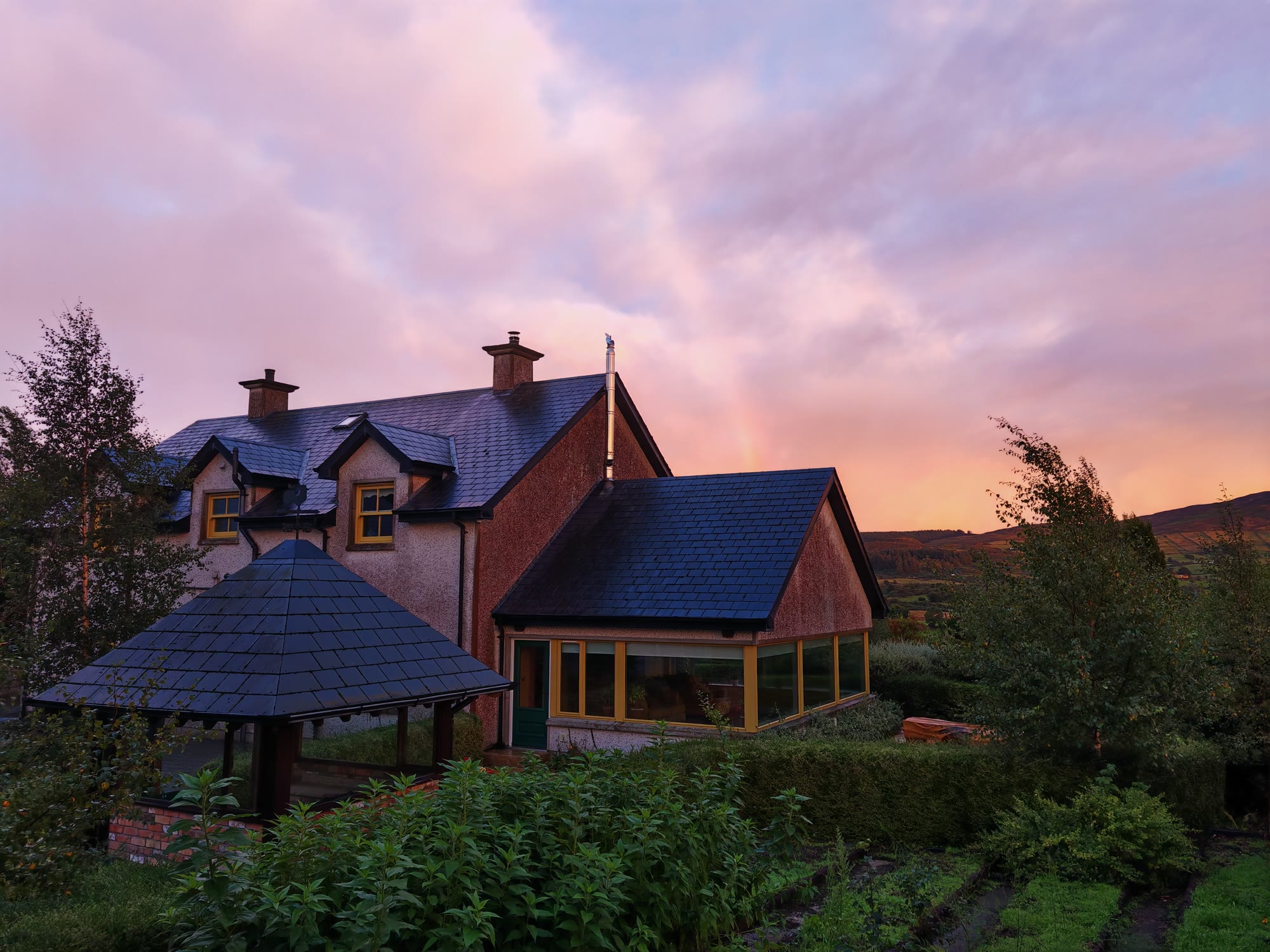 The main house at Yellow Rock Sanctuary beneath an evening sky